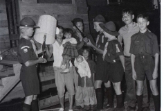 Envelope 4018 Al Gassner and Vicki receiveing gun and lamp scouts bougt after house burnt down