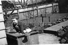 Photo Booklets151 Mick backyard home on 2nd ave spring 1952